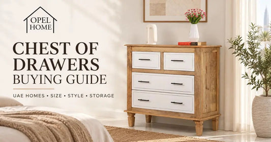 Four-drawer wooden chest of drawers with white drawer fronts in a bright bedroom